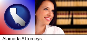Alameda, California - a young, female attorney in a law library