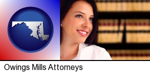 Owings Mills, Maryland - a young, female attorney in a law library