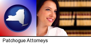 Patchogue, New York - a young, female attorney in a law library