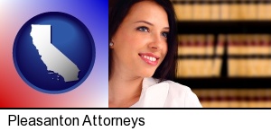 Pleasanton, California - a young, female attorney in a law library