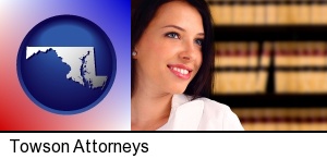 Towson, Maryland - a young, female attorney in a law library
