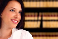 a young, female attorney in a law library