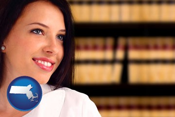 a young, female attorney in a law library - with Massachusetts icon