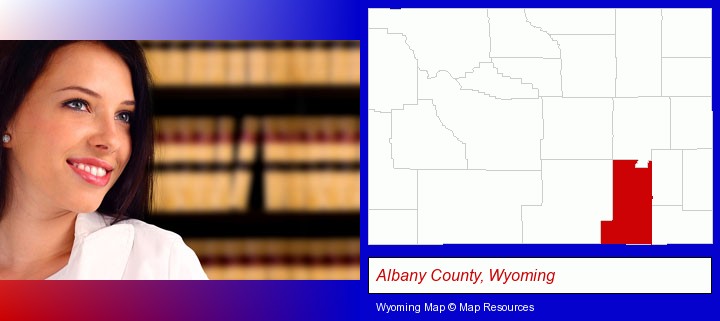 a young, female attorney in a law library; Albany County, Wyoming highlighted in red on a map
