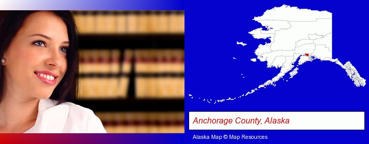 a young, female attorney in a law library; Anchorage County, Alaska highlighted in red on a map