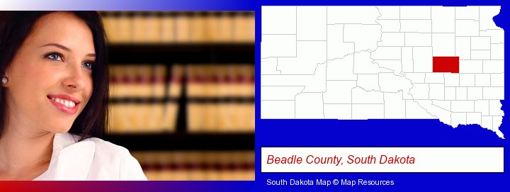 a young, female attorney in a law library; Beadle County, South Dakota highlighted in red on a map