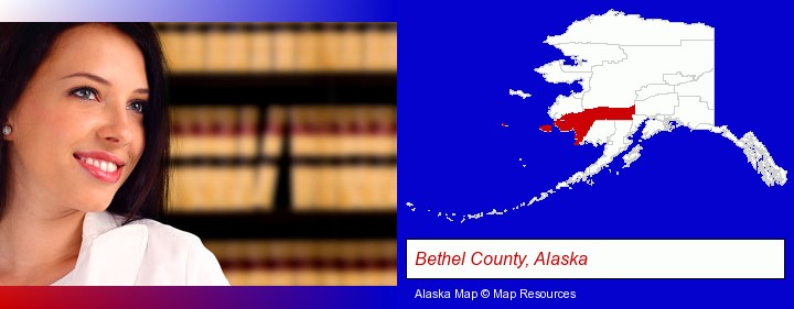 a young, female attorney in a law library; Bethel County, Alaska highlighted in red on a map