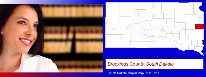 a young, female attorney in a law library; Brookings County, South Dakota highlighted in red on a map