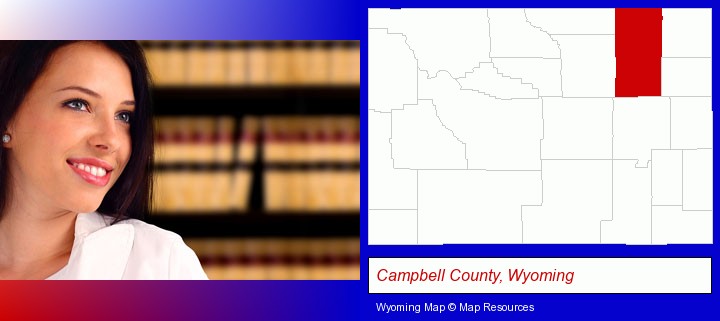 a young, female attorney in a law library; Campbell County, Wyoming highlighted in red on a map