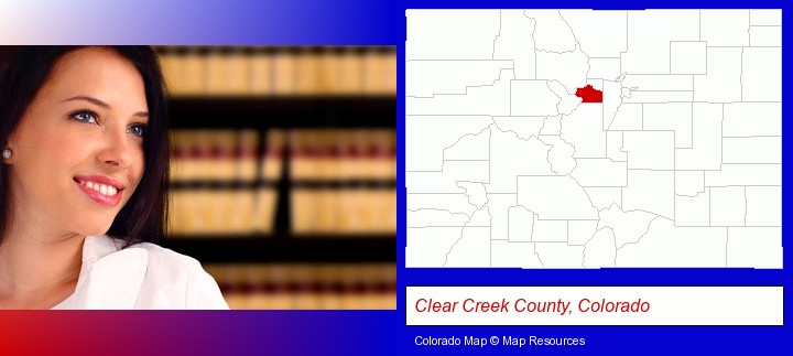 a young, female attorney in a law library; Clear Creek County, Colorado highlighted in red on a map