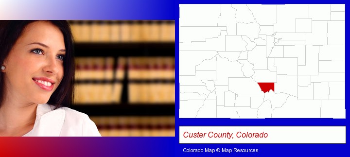 a young, female attorney in a law library; Custer County, Colorado highlighted in red on a map