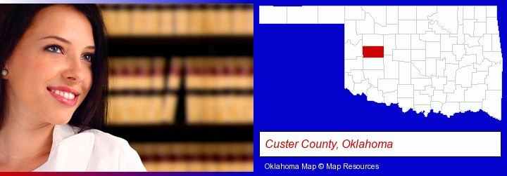 a young, female attorney in a law library; Custer County, Oklahoma highlighted in red on a map