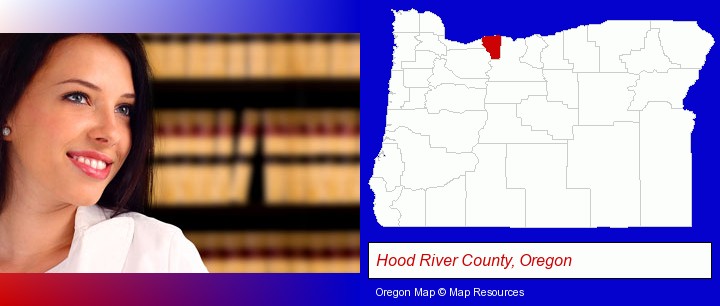 a young, female attorney in a law library; Hood River County, Oregon highlighted in red on a map