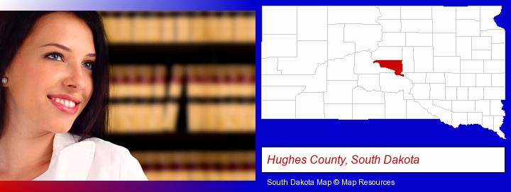 a young, female attorney in a law library; Hughes County, South Dakota highlighted in red on a map