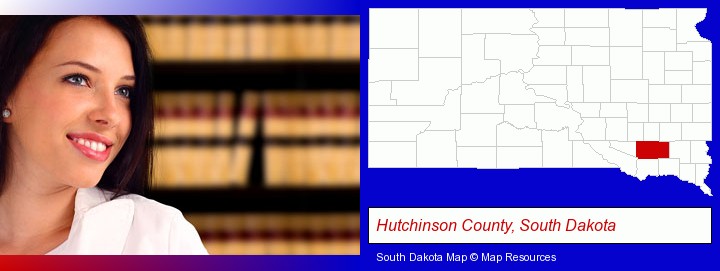 a young, female attorney in a law library; Hutchinson County, South Dakota highlighted in red on a map