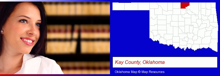 a young, female attorney in a law library; Kay County, Oklahoma highlighted in red on a map