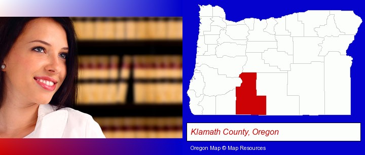 a young, female attorney in a law library; Klamath County, Oregon highlighted in red on a map