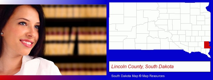 a young, female attorney in a law library; Lincoln County, South Dakota highlighted in red on a map