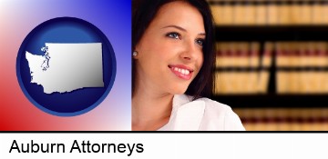 a young, female attorney in a law library in Auburn, WA