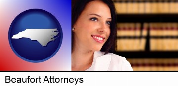 a young, female attorney in a law library in Beaufort, NC