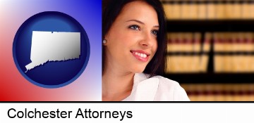a young, female attorney in a law library in Colchester, CT