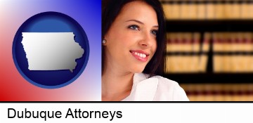 a young, female attorney in a law library in Dubuque, IA