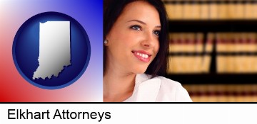a young, female attorney in a law library in Elkhart, IN