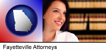 a young, female attorney in a law library in Fayetteville, GA