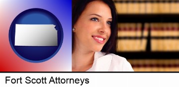 a young, female attorney in a law library in Fort Scott, KS