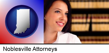 a young, female attorney in a law library in Noblesville, IN