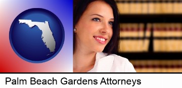 a young, female attorney in a law library in Palm Beach Gardens, FL