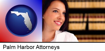 a young, female attorney in a law library in Palm Harbor, FL