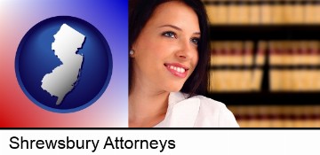 a young, female attorney in a law library in Shrewsbury, NJ