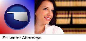 a young, female attorney in a law library in Stillwater, OK